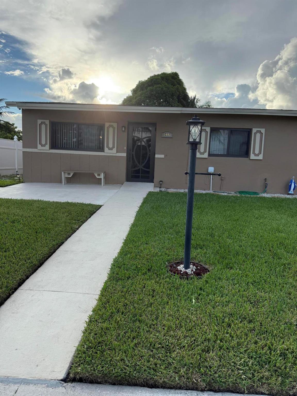 Cosey 3/1 home with bonus room and bonus bath with separate entrance for potential rental income.located in the back of the residence. New roof,appliances, impact windows and door. No HOA