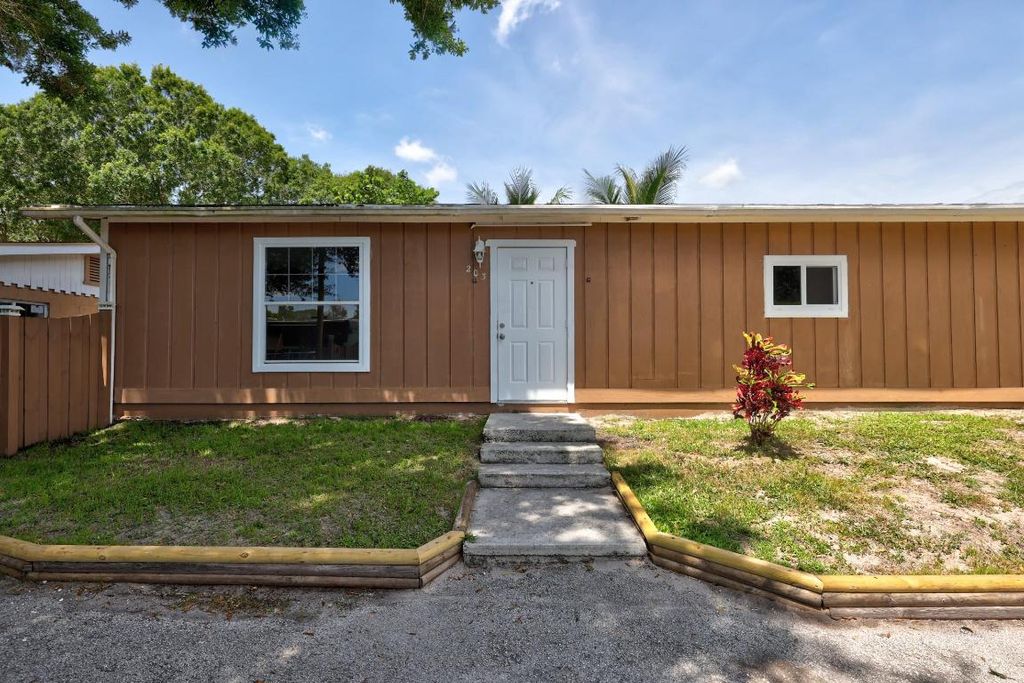 Photo of 201 Dixieland Drive #203, Fort Pierce, FL 34982 (MLS # R10951458)