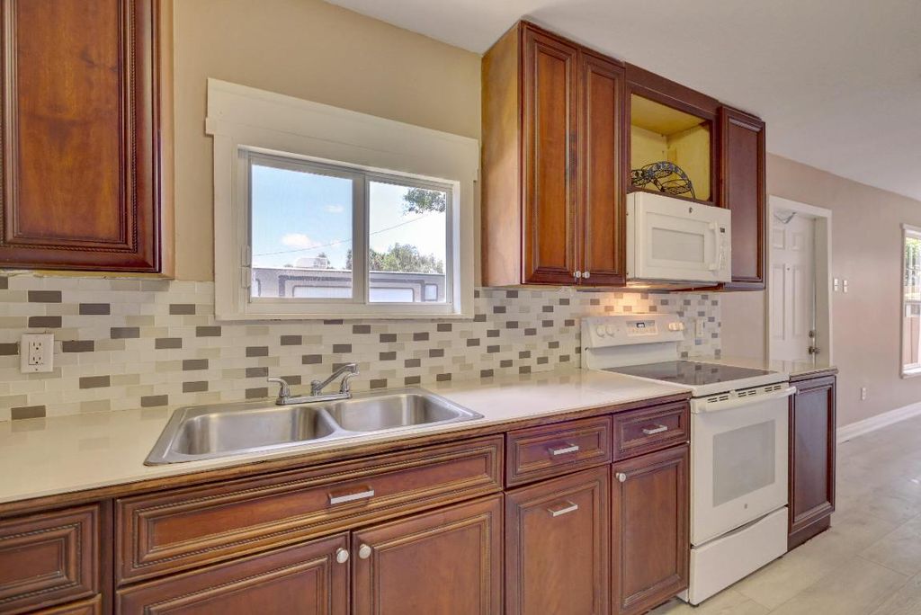 Photo of 201 Dixieland Drive #203, Fort Pierce, FL 34982 (MLS # R10951458)