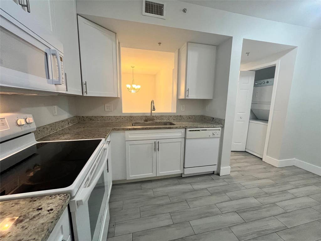 Photo of 1161 GOLDEN LAKES Boulevard #1316, West Palm Beach, FL 33411 (MLS # B26068722)