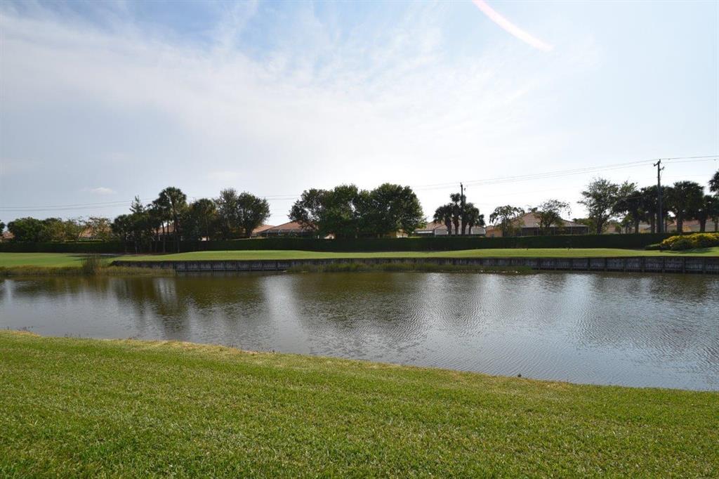BEAUTIFUL 3 BEDROOM 3 BATH BEN HOGAN MODEL WITH ONE OF THE BEST VIEWS IN THE COMMUNITY.OVERLOOKS LAKE AND GOLF COURSE, COMPLETELY UPDATED OPEN KITCHEN CONCEPT, PORCELAIN TILE FLOORS THRU OUT, NEW LIGHTING, NEW CABINETS, NEW FIXTURES, NEW COUNTERTOPS, NO POPCORN,NEW STAINLESS APPLIANCES, NEW PATIO HURRICANE WINDOWS, A REAL GEM AND MUST SEEEASY TO SEE CALL FOR SHOWING