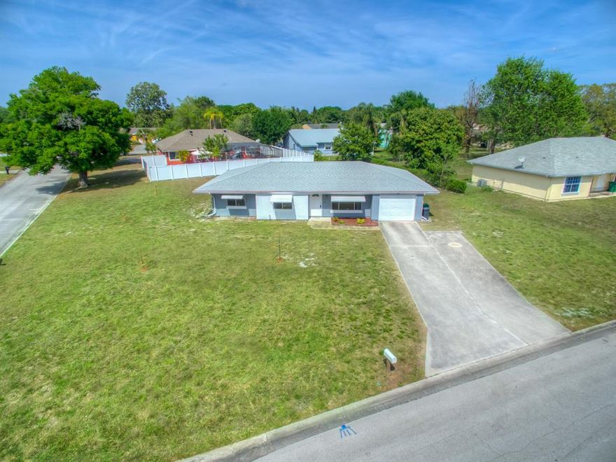 There is not much missing from this 3/2/1 home. It has been completely remodeled with wood look tile flooring, interior & exterior paint, and hunter ceiling fans in the living areas. The kitchen was upgraded to gorgeous quartz counter tops with soft closing white cabinets and matching back splash. Samsung stainless steel appliances are also included. The 2 bathrooms have be refinished with designer tile showers, new vanities and a seamless glass shower in the master bath. A new water heater was recently installed, 2016 Roof/ 2013 AC. The expansive 14'x22' screen enclosed back patio and large corner lot makes for great room to play. In this community you have access to the club house, community pool, sport courts, with a $225/yr fee.