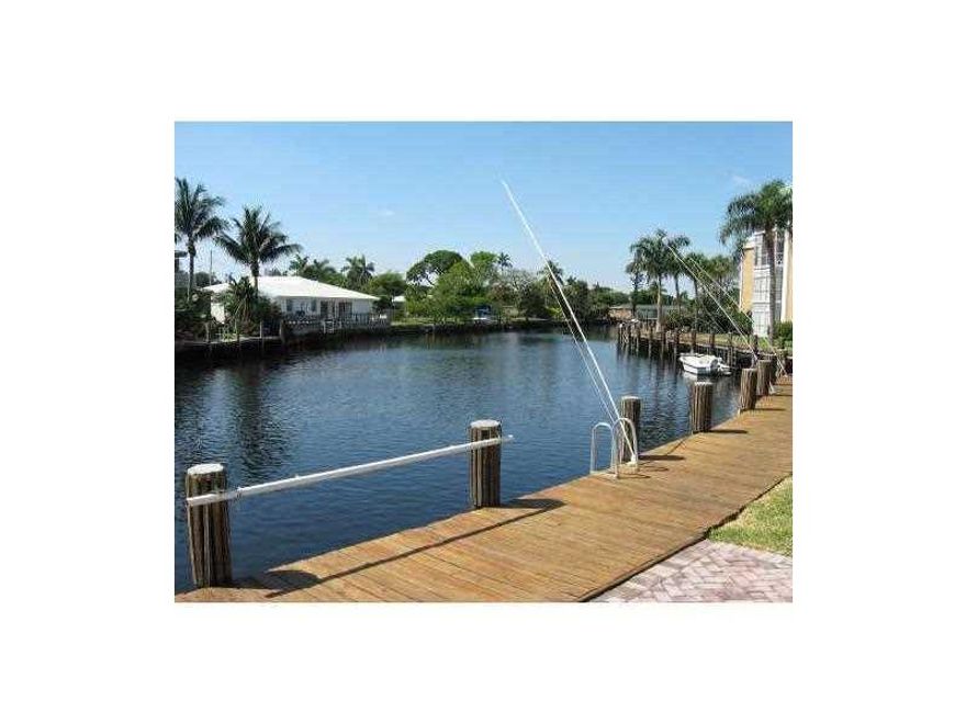 Located in a gated community on the East side of town! Spacious 2/2 condo with screened balcony that opens from the living room and master bedroom.  Huge living room, huge master bedroom.  Community located on the Middle River with waterside pool, clubhou se, tennis courts.  Very well maintained!