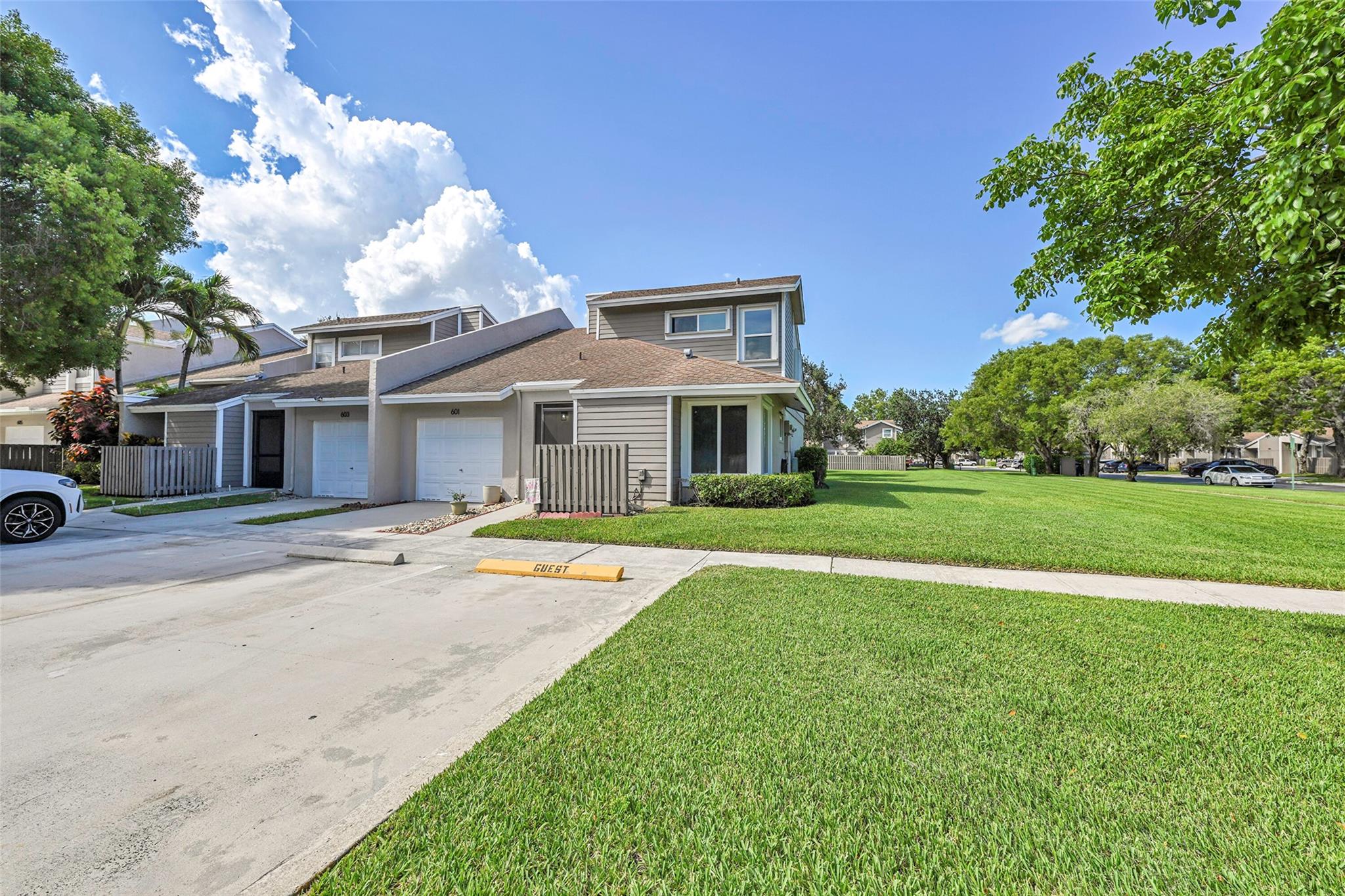 Welcome to Woodgate in Sunrise! This beautifully updated turn-key corner townhome is a true gem in one of the most sought-after communities. Featuring 3 spacious bedrooms, 2 bathrooms, a 1-car garage, & 3 additional parking spaces, this home has it all. Step into an open-concept layout with vaulted ceilings & an abundance of natural light. The brand-new chef’s kitchen opens to an oversized living area—perfect for entertaining. Enjoy two fully renovated bathrooms, impact windows, & walk-in closets. Relax on the north-facing screened patio. The community offers fantastic amenities including a pool & tennis courts. Conveniently located near I-595 & I-75, just minutes from Sawgrass Mills Mall, top-rated restaurants, shopping, scenic walking/bike trails, & zoned for A-rated schools.