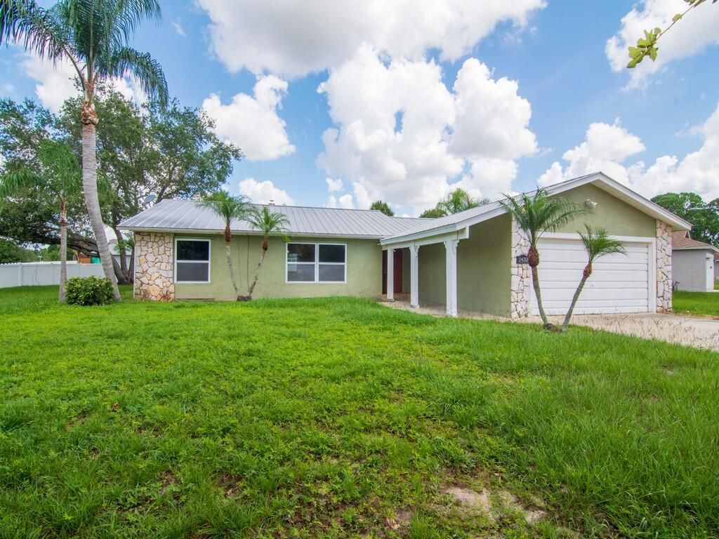 Photo of 2432 SW Loquat Road, Port St Lucie, FL 34953 (MLS # R10902263)
