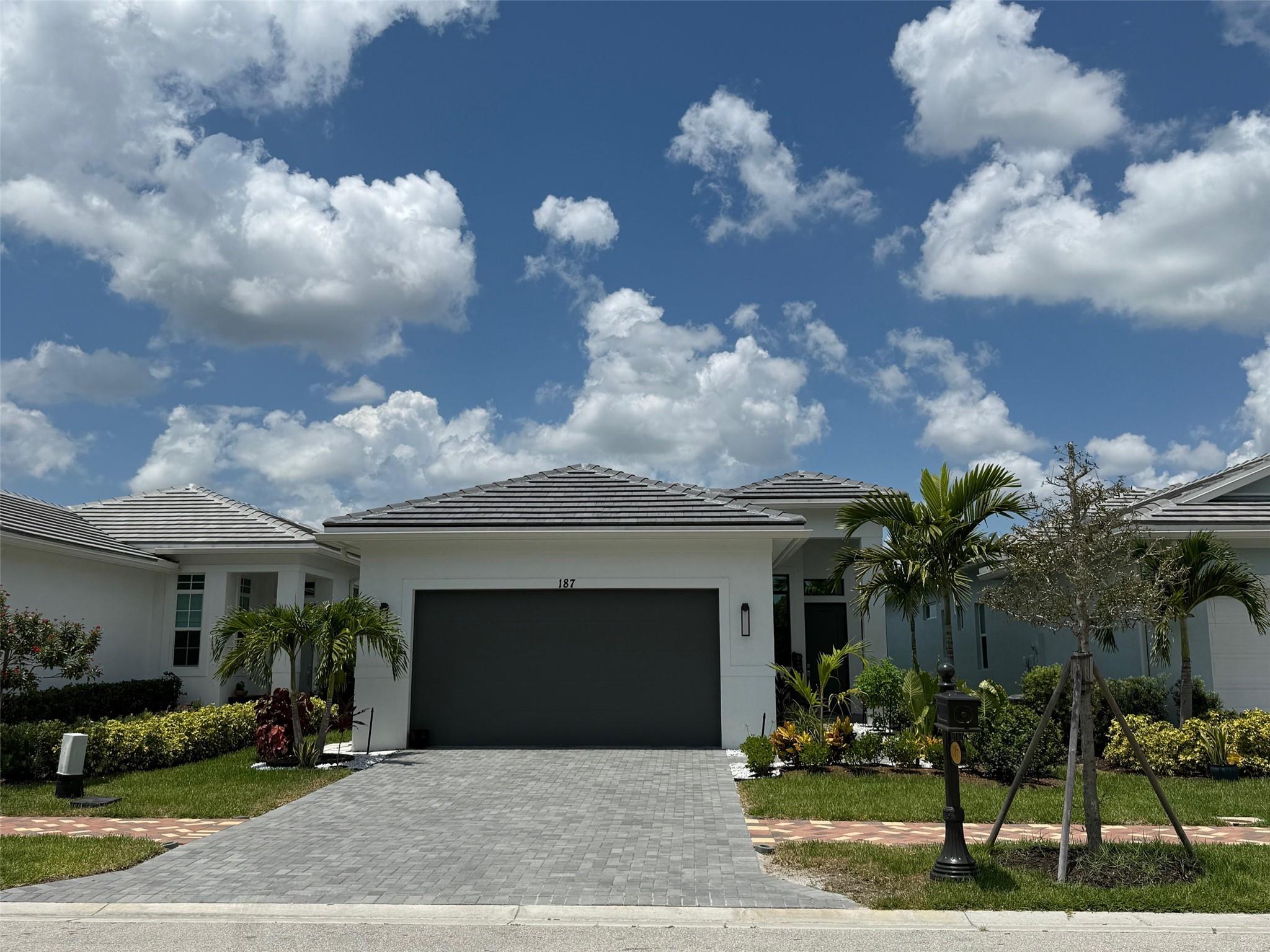 **NEW CONSTRUCTION**6 Months occupied**BUILDER WARRANTY** MOVE IN READY-Privacy window film/tint installed - 70-80% HEAT Reduction, UV 99% reduction, tint, Custom 4.5-inch louvers Plantation Shutters installed, Large custom sliders 10X12, High Celling, Extra Spotlights, New Landscape Front -Rocks and Back Privacy Clusia Fence, Fruit trees, Landscape, Patio Roller UV Shades. Chef's Kitchen, Counter Debt Twin Climate Refrigerator, GE Profile SMART WIFI operated appliances, Upgraded sleek kitchen hood, upgraded Wi-Fi operated smart washer and dryer, bigger sizes, EPOXY floor in 2 car garage, tiles in main area and den/dining area, upgraded flush kitchen cabinets and custom hardware added, carpet in bedrooms, tile in built in closet, shelving. TV hooks in higher location for TV wall mount.