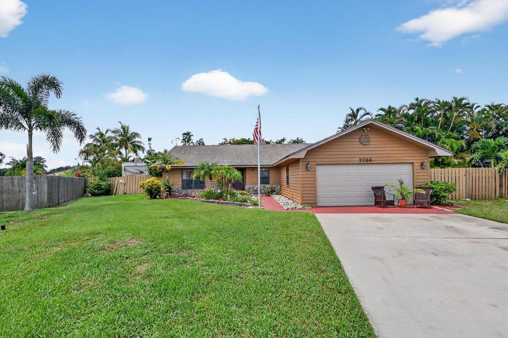 Photo of 7700 Woodland Creek Lane, Lake Worth, FL 33467 (MLS # R11106185)