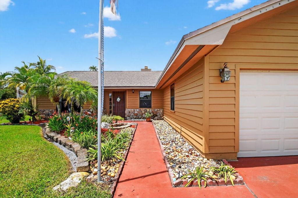 Photo of 7700 Woodland Creek Lane, Lake Worth, FL 33467 (MLS # R11106185)