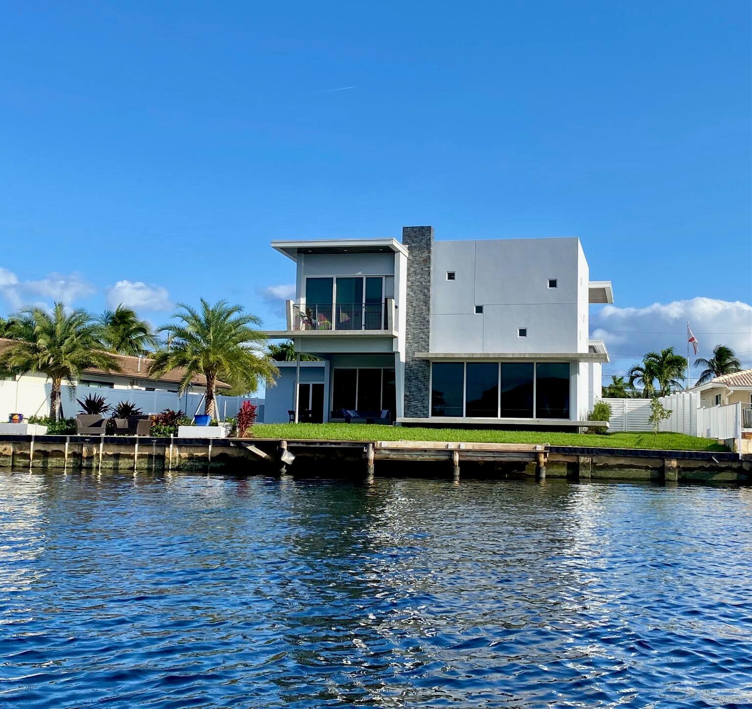 Spectacular, new construction, modern home situated on an oversized lot on an expansive waterway leading to intracoastal. Designed & built by the homeowner (structural engineer/architect), you won't find a more structurally sound home in the area! This home boasts stunning & unique architectural features throughout including 2 story stacked-stone great room wall, custom wood ceiling inlays both inside & out, and a floating staircase with custom railing leading to your private upstairs oasis. The master retreat is spacious offering floor to ceiling sliders opening to your private balcony, his/hers walk-in custom closets, a sumptuous master bathroom including private water closet, his/hers vanities, & an oversized double shower with soaking tub,