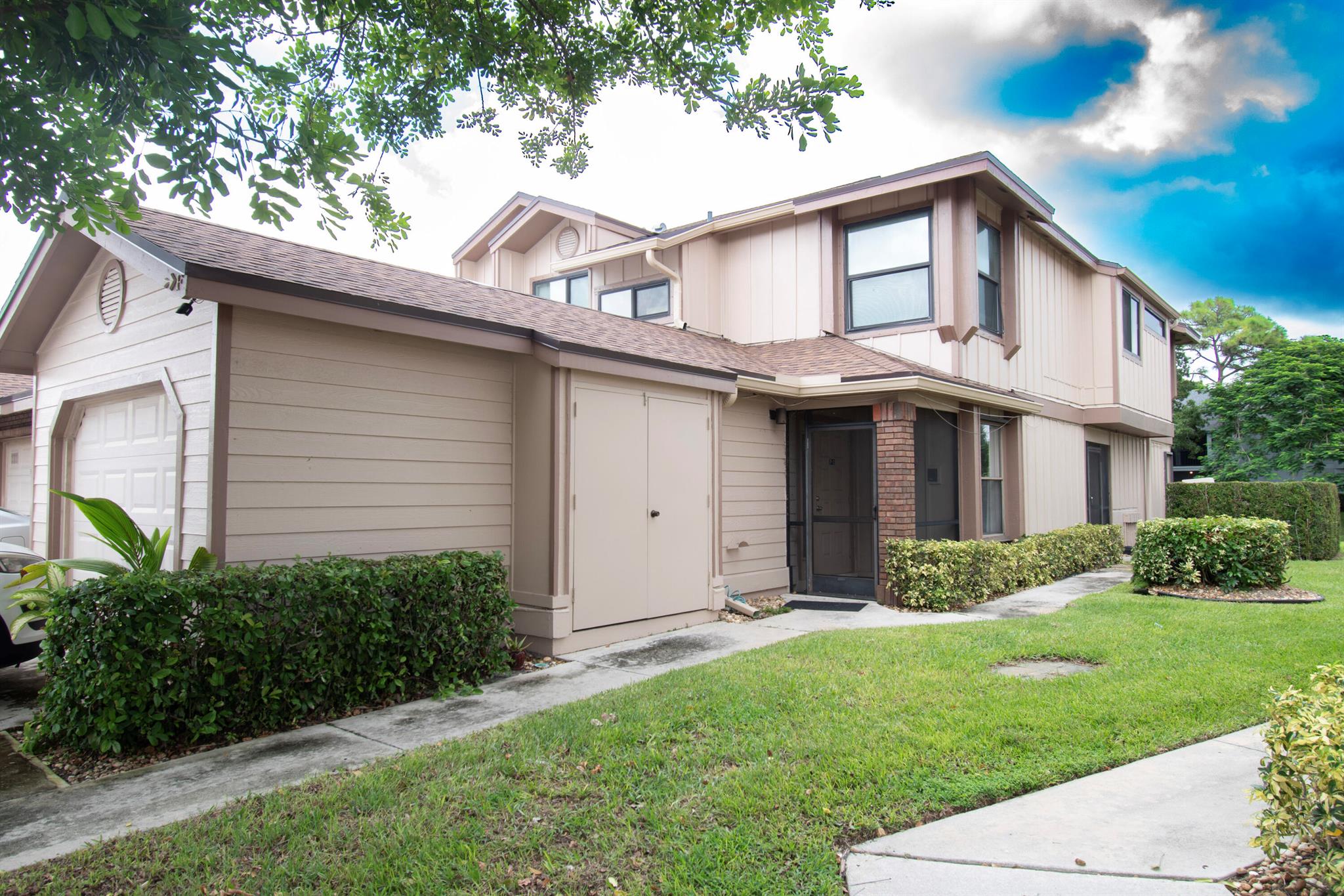 This 3-bedroom, 2-bath corner unit condo features 1,298 sq. ft. of living space, a screened patio, attached garage, and beautiful lake views. HOA fees include water, cable TV, high-speed fiber internet, building insurance, exterior maintenance, and full-time security. Residents enjoy a fully staffed clubhouse with social director, performance and fitness centers, multi-purpose activity rooms, billiards, tennis, pickleball, basketball, shuffleboard, Bocce, and ping pong. Relax in one of several heated pools including the main pool, south pool, kiddie pool, or the spa/jacuzzi. Crosswinds at River Bridge, a sought-after guard-gated community offering true resort-style living.