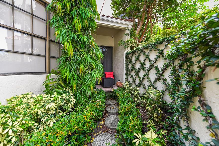 Discover this charming two bedroom, two bathroom upgraded & professionally designed villa, situated on the 9th hole of the award-winning Fazio-designed 18-hole golf course. This villa boasts a light, bright, & airy decor, featuring a beautiful tropical garden & spa view. The cozy office/den area, large master bedroom with an expansive closet, & tastefully elegant ensuite bathroom provide a touch of luxury. Within walking distance, you'll find the recently remodeled clubhouse, expansive fitness center, active tennis & pickleball courts, golf pro shop, driving range, children's playground, resort-style pool, savory poolside cafe, boutique shopping, & trendy restaurants. Embrace the secure & exclusive lifestyle you truly deserve. Call today for your private tour.