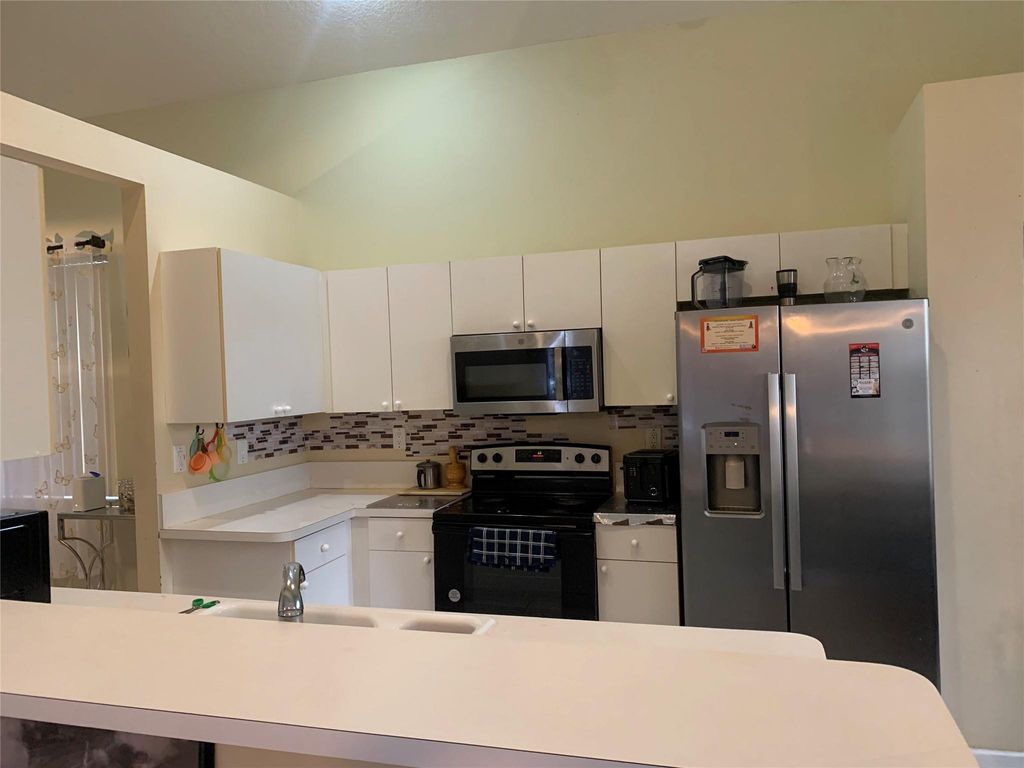 Photo of 320 NW 115th Way, Coral Springs, FL 33071 (MLS # F10554480)