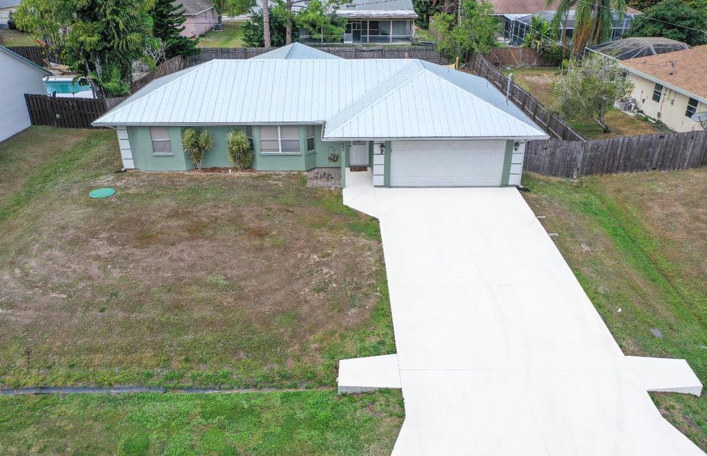 Photo of 407 SW Molloy Street, Port Saint Lucie, FL 34984 (MLS # R11152322)