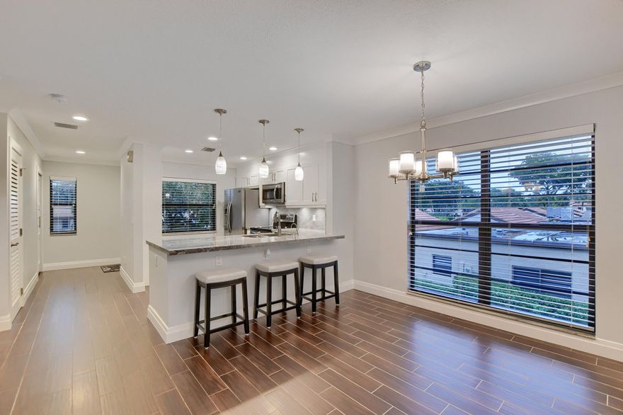 Welcome to this stunning second floor 2 bed, 2 bath condo in All-Ages Gated Community of Horizons of Boca Lago.  Nothing to do but move in!  Open concept living with the new kitchen flowing into the dining & living areas & your views of the golf course from the screened balcony. Special features include white shaker wood cabinets & pantry, granite countertops, SS appliances, plus Instant hot water, under cabinet lighting, & gorgeous pendants over the kitchen breakfast.  The two bedrooms are generously sized with the primary having three closets with one a walk-in closet with built-ins, double sinks;  both bathrooms offer floor-to ceiling tiled shower walls & frameless shower enclosures. Convenient stackable W&D in the unit.   The entire unit is fully tiled throughout with 5.25'' baseboards More Special features include: integrated LED lighting throughout, new crown molding and painting, new water heater and newer AC.  Please view all details of all upgrades under the document section (please ask your agent for this information). No details have been overlooked.