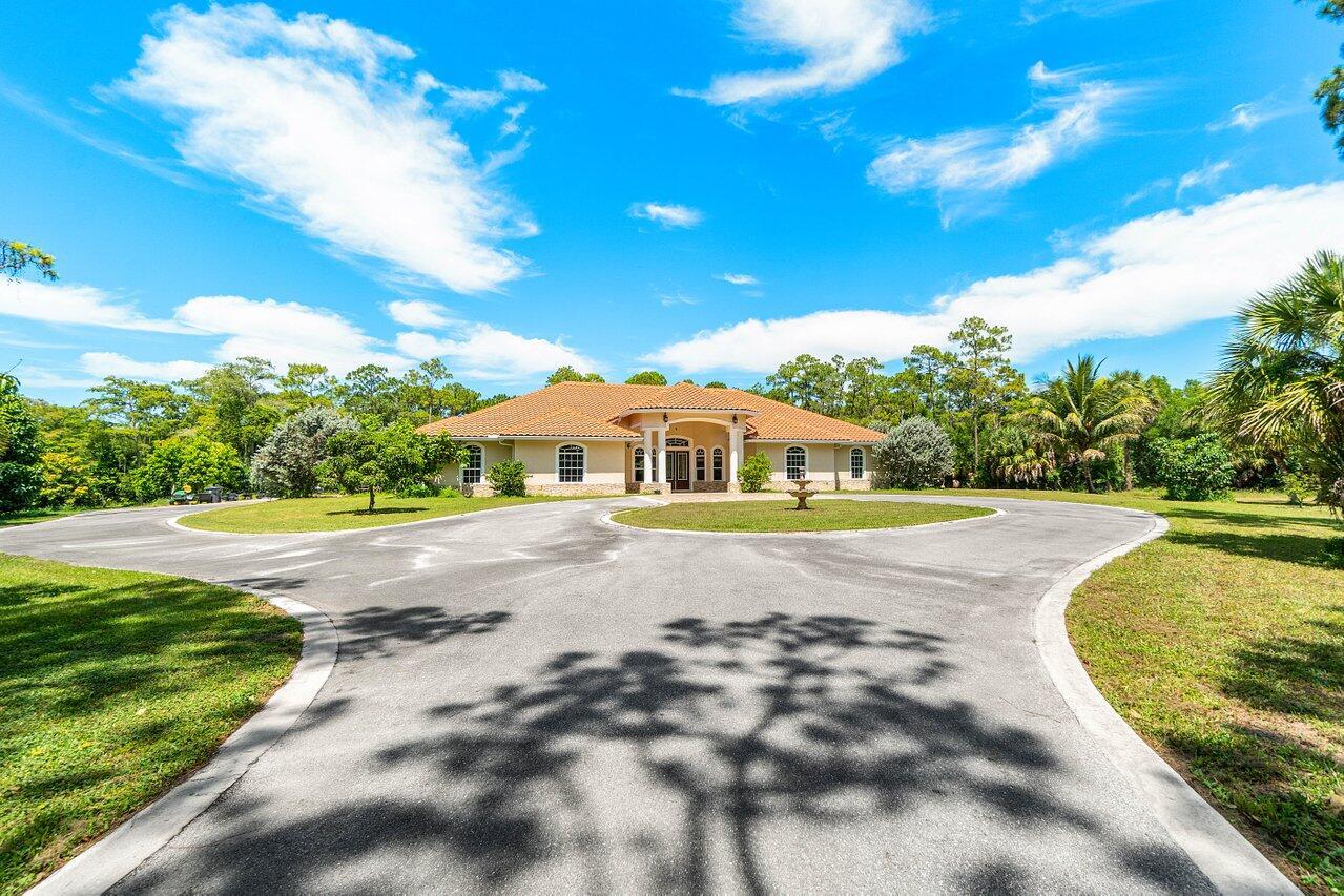 This home is an absolute STUNNER! One owner home built in 2016 with all the conveniences and luxury finishes in mind! Enjoy the privacy and serenity all while having peace of mind knowing your entire property is built on high and dry 5 acres! Jaw dropping curb appeal the moment you pull in the driveway! Once you open the front door you'll be invited by a great open floor plan with natural light beaming through the impact windows off of the marble floor throughout! The home features 4 bedrooms, 3 full baths and 2 half baths! Bring all your toys with the oversized 3 bay garage! The one garage is separated and has ductless AC perfect for an office, gym, studio, storage or just another garage! Plenty of outdoor space for weekend get togethers and family functions! Schedule your tour today!