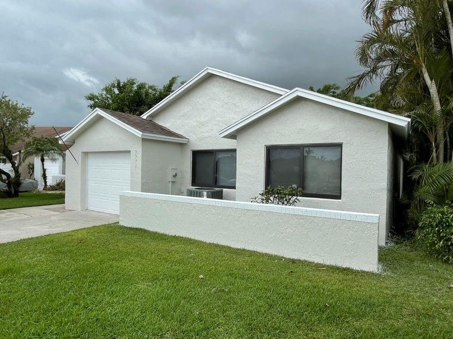 Beautiful 3 bed, 2 bath remodeled home including a bonus Florida room in the much desired area in the community of Pine Springs. Located at the end of a quiet cul de sac. A+ rated school district. New hurricane rated windows and doors. All new floors, doors, trim etc.  Just freshly painted inside and out. Kitchen has granite countertops and all new stainless steel appliances. Low HOA includes cable, lawn, garbage, club house and pool. Perfectly located with easy walk to local shopping and restaurants. Close to easy access to Turnpike and other highways.This is a must see!! It will not last long schedule your appointment today!!