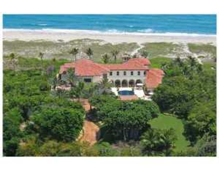 Set on two acres of prime oceanfront property with 150 feet of frontage, this European-inspired estate evokes a timeless elegance in every room, with six bedrooms, seven full baths, three half baths and an unsurpassed attention to detail. Upon entry, a winding gated drive gives way to panoramic ocean views and an intricately tiled vaulted loggia. Highlights include a grand scale gourmet kitchen with accented marble and granite countertops and custom glazed cabinetry, a first floor master suite with his and her baths, and a cherry-paneled library. For outdoor enjoyment, the estate features both an Oceanside summer pool and a courtyard winter pool complete with an entertainment pavilion and outdoor kitchen. Additionally the property includes a four -car garage, generator, and an advanced