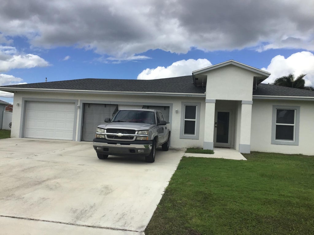Photo of 1233 SW MEDINA Avenue, Port Saint Lucie, FL 34953 (MLS # B26092209)