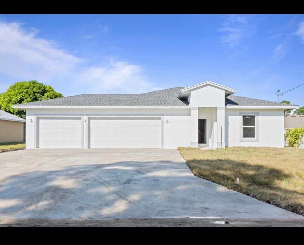 Photo of 1233 SW MEDINA Avenue, Port Saint Lucie, FL 34953 (MLS # B26092209)