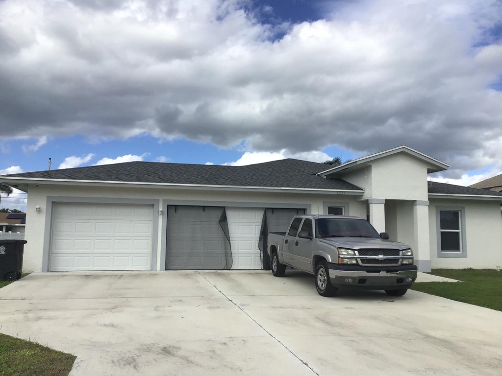 Photo of 1233 SW MEDINA Avenue, Port Saint Lucie, FL 34953 (MLS # B26092209)