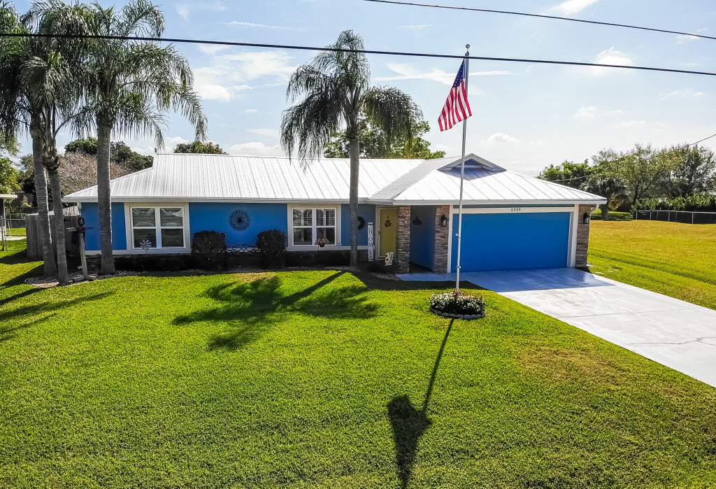 Photo of 2339 SW Kent Circle, Port Saint Lucie, FL 34953 (MLS # R10968889)