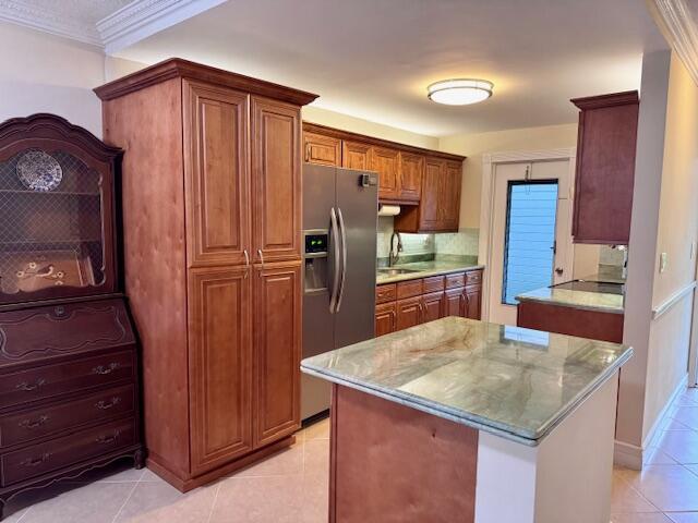 Updated 2-Bedroom 1 - Bath Annual Rental in Lighthouse Point. Available for annual non-renewing lease, this first-floor residence is in excellent condition--well maintained, spotless, and move-in ready. Internet, cable, water, garbage included. Furniture is optional and negotiable. The unit has a nice open kitchen, modern bathroom, and nice tile flooring. Large windows bring in natural light and offer serene tropical views. Private screened porch. The building is well maintained and has passed its 40-year inspection. Roof is (2022). Nestled on a charming street, all ages are welcome. Amenities include a heated saltwater pool, pickleball court, clubhouse, outdoor kitchen/BBQ area, picnic tables, car wash, and designated and guest parking.