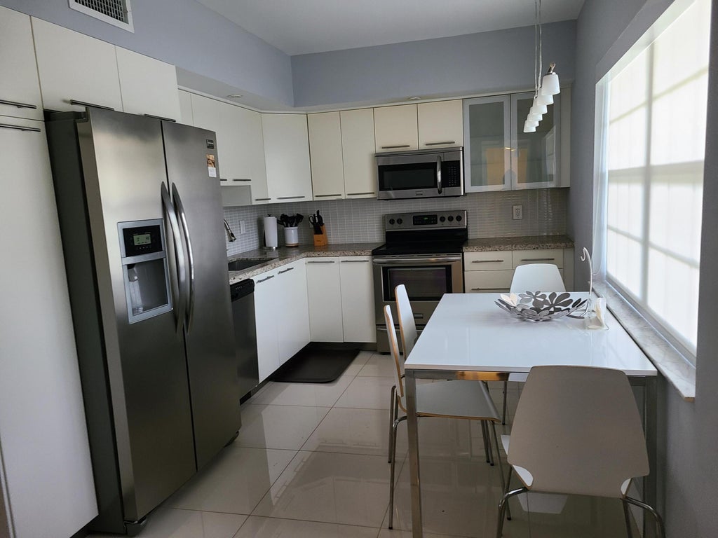 Photo of 804 Cypress Boulevard #104, Pompano Beach, FL 33069 (MLS # B26043411)