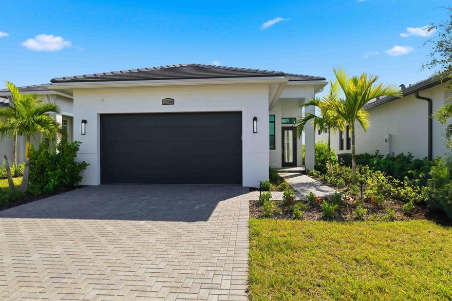 Discover this practically brand-new (only lived in for 5 months) 3-bedroom, 2-bathroom, 2-car garage home in the highly sought-after community of Verano in Port St. Lucie. The popular Caroline model by Kolter Homes features a total of 2,508 sq. ft., including 1,787 sq. ft. of living space. Enjoy the best of Florida indoor-outdoor living with an extended master bedroom for ultimate comfort and an upgraded summer kitchen perfect for entertaining. The spacious, covered lanai offers a serene, lakefront view for relaxing evenings.  Vacant and ready to move in!