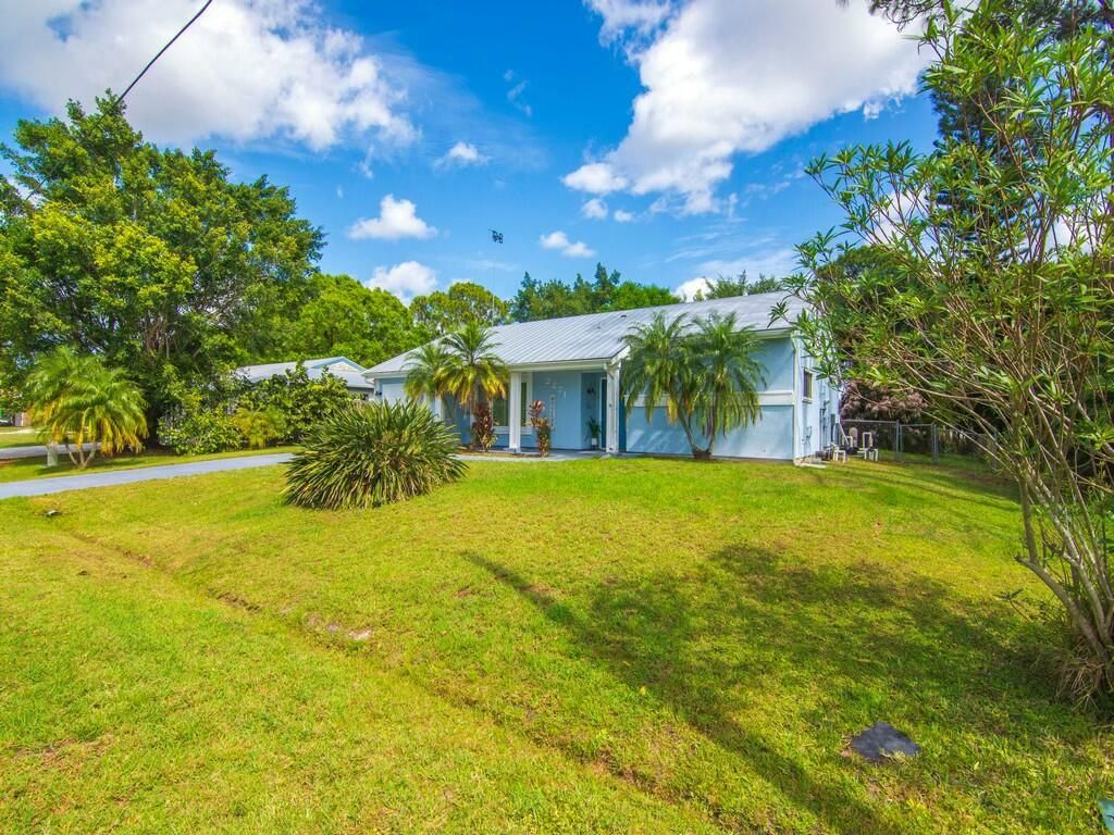 Photo of 2271 SE Aneci Street, Port Saint Lucie, FL 34984 (MLS # R11065566)