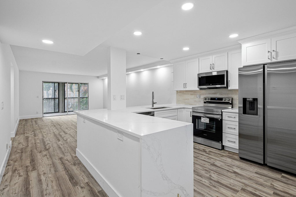 Photo of 6585 Kensington Lane #Apt 207, Delray Beach, FL 33446 (MLS # B26081891)