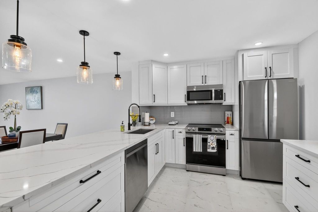 Photo of 2300 NE 1st Lane #201, Boynton Beach, FL 33435 (MLS # F10521383)