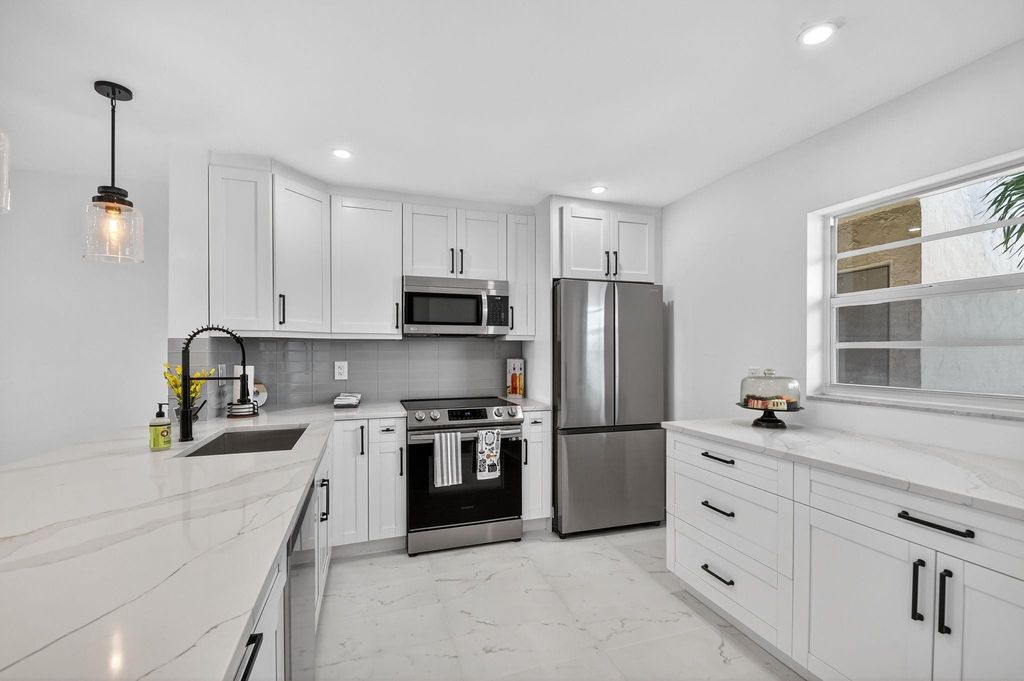 Photo of 2300 NE 1st Lane #201, Boynton Beach, FL 33435 (MLS # F10521383)