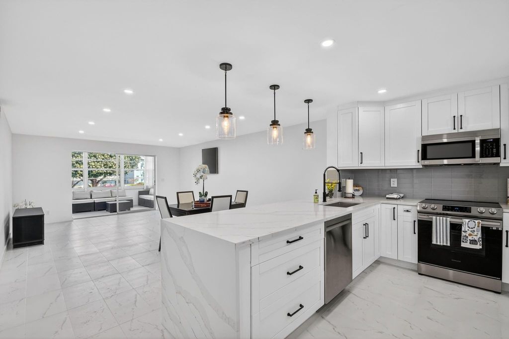 Photo of 2300 NE 1st Lane #201, Boynton Beach, FL 33435 (MLS # F10521383)