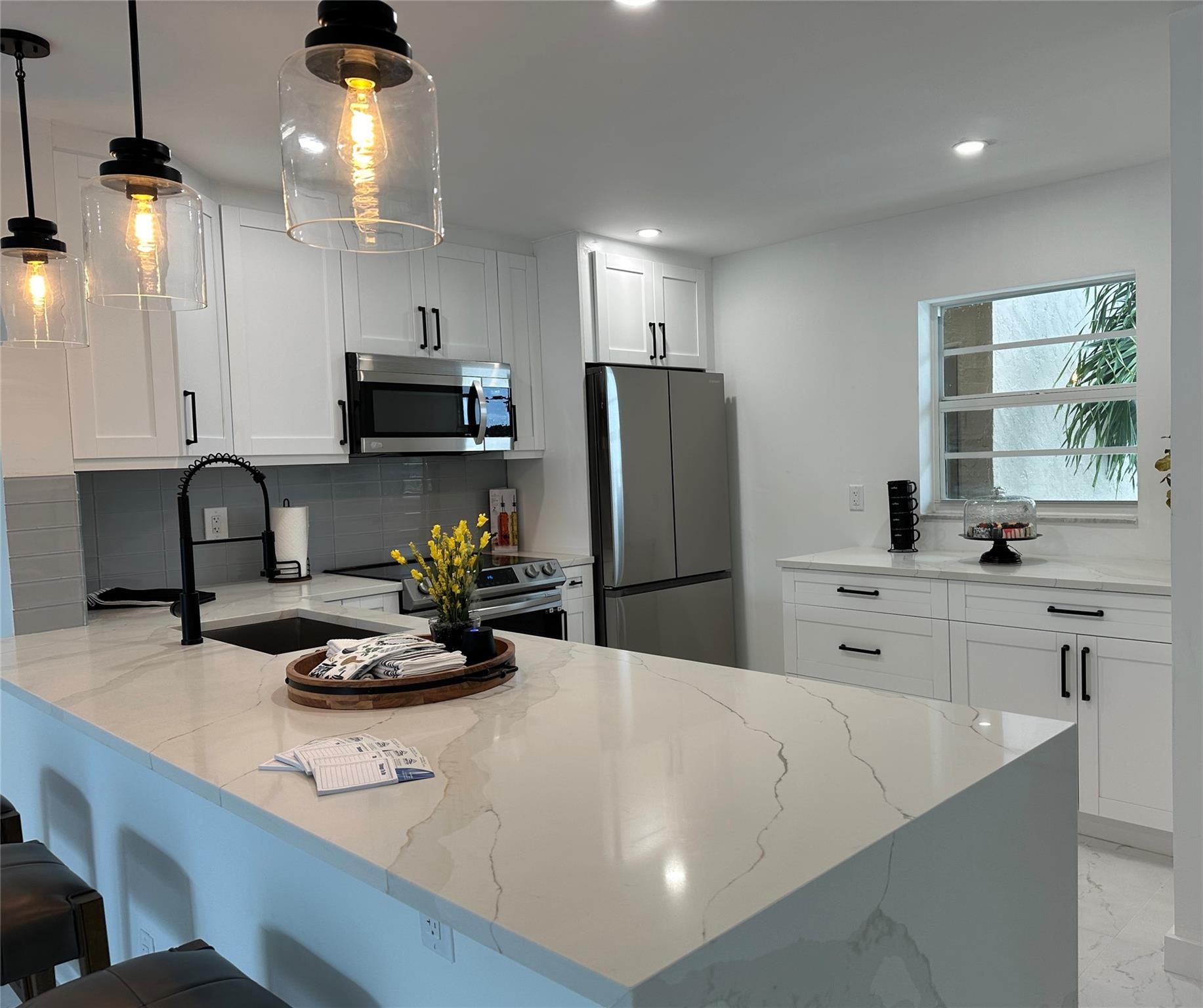 No minimum down payment required , condo association is fully funded, 2nd floor corner unit. This unit offers 2 walk in closets , 2 showers, extra closets space, new title floor new appliances, new electrical and electrical panel everything was done with permits , new kitchen and bathrooms .Residents have access a clubhouses used for performances, holiday gatherings, and other community events, card room, library, billiards room, outdoor pool and patio, shuffleboard, BBQ for special event, and walking paths throughout the community. Village Royale is situated i near shopping and major roadways, have plenty of golf courses and beautiful beaches within a short drive., cable,water,internet included.