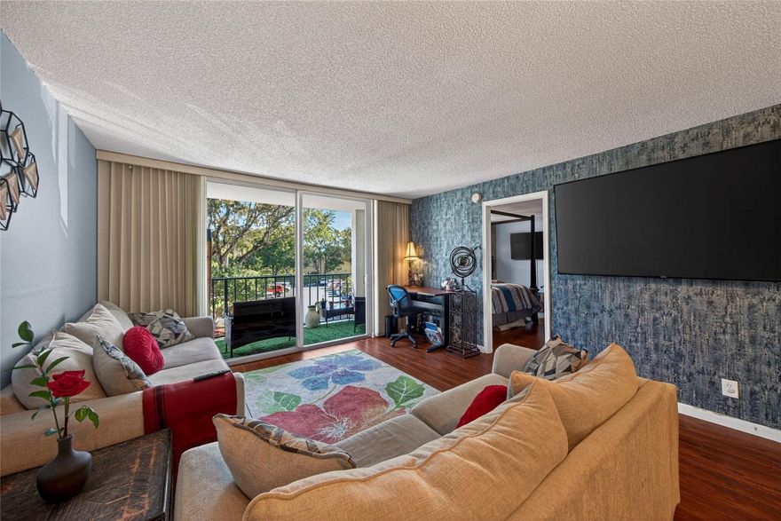 Beautiful 2-bed, 2-bath corner unit at Drake Tower Condos. Gated community with lush landscaping, strong on-site management, recent upgrades including a new pool & sun deck. Monthly fees include water, cable, internet, pest control. Secured entry with fob access & video phone app call box, resident meeting room, and gated parking area.  A laundry room on each floor with two washers, two dryers, and private storage for each unit. This condo features wood floors throughout, tiled baths, stainless steel appliances, and a pass-through kitchen to the living/dining area. Impact windows and sliding doors lead to a balcony overlooking the pool and sundeck. Both bedrooms accommodate king-size beds; primary suite includes en-suite bath w/ tub, second bath offers walk-in shower. Walk to the Drive.