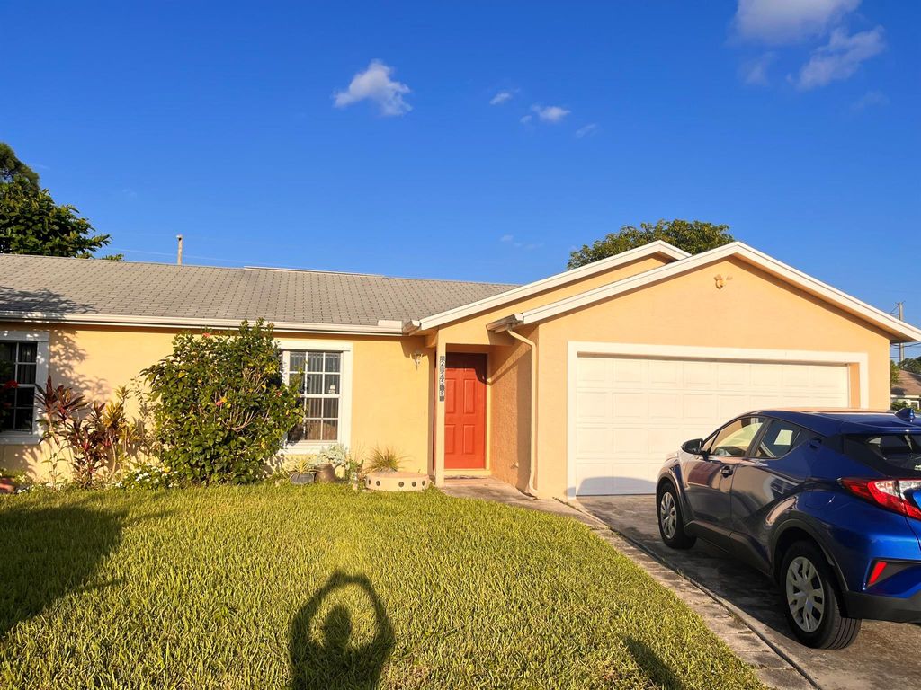 Photo of 2255 SW Haycraft Circle, Port St Lucie, FL 34953 (MLS # R10915421)