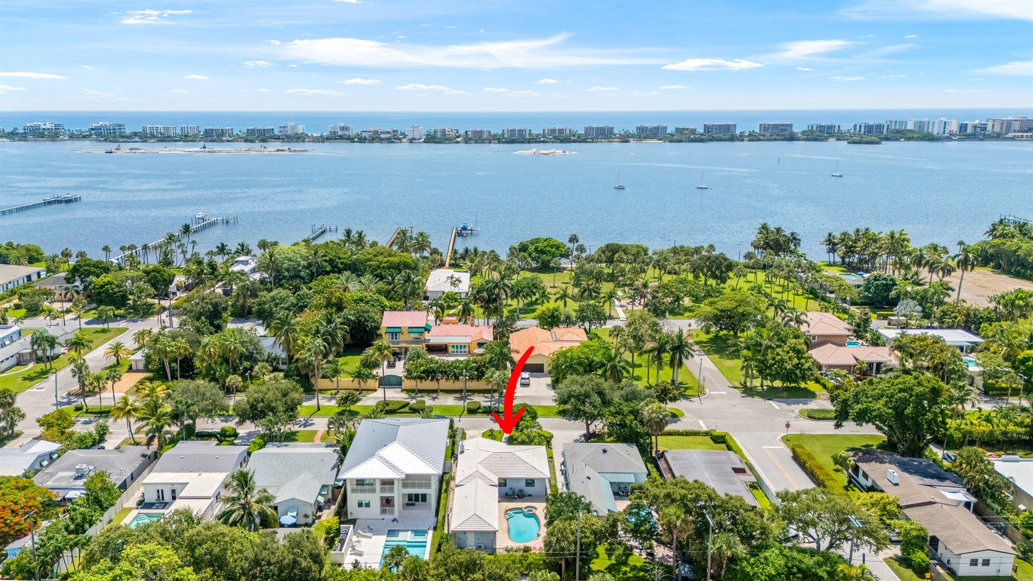 Enjoy the best of coastal living just two blocks from the Intracoastal in this beautifully updated 4BR/2.5BA home in Lake Worth Beach's historic South Palm Park! Surrounded by native landscaping, this charming single-story residence features a spacious open family room, updated kitchen and baths, and a beautiful primary suite with a walk-in closet and ensuite spa like bath featuring a walk-in shower. Step outside to your private backyard oasis with a heated pool, manicured lawn, and off-street parking. A rare gem near the waterfront--don't miss this opportunity!