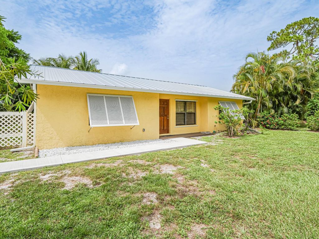 Photo of 502 SW Sansom Lane, Port Saint Lucie, FL 34953 (MLS # F10452512)