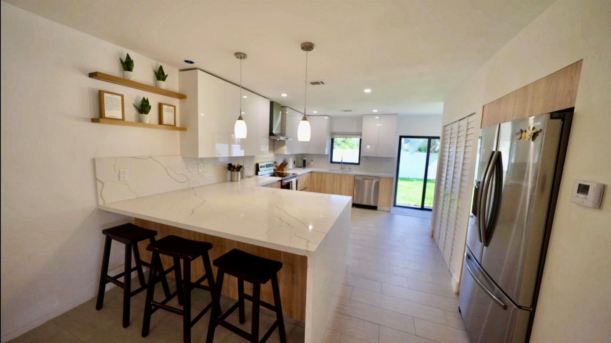 Beautifully updated 3-bedroom, 3-bath home featuring an open-concept layout, modern kitchen with quartz countertops and stainless-steel appliances, impact windows throughout, and a spacious backyard perfect for entertaining. Located just minutes from top-rated schools, shopping, and the beach. Move-in ready!