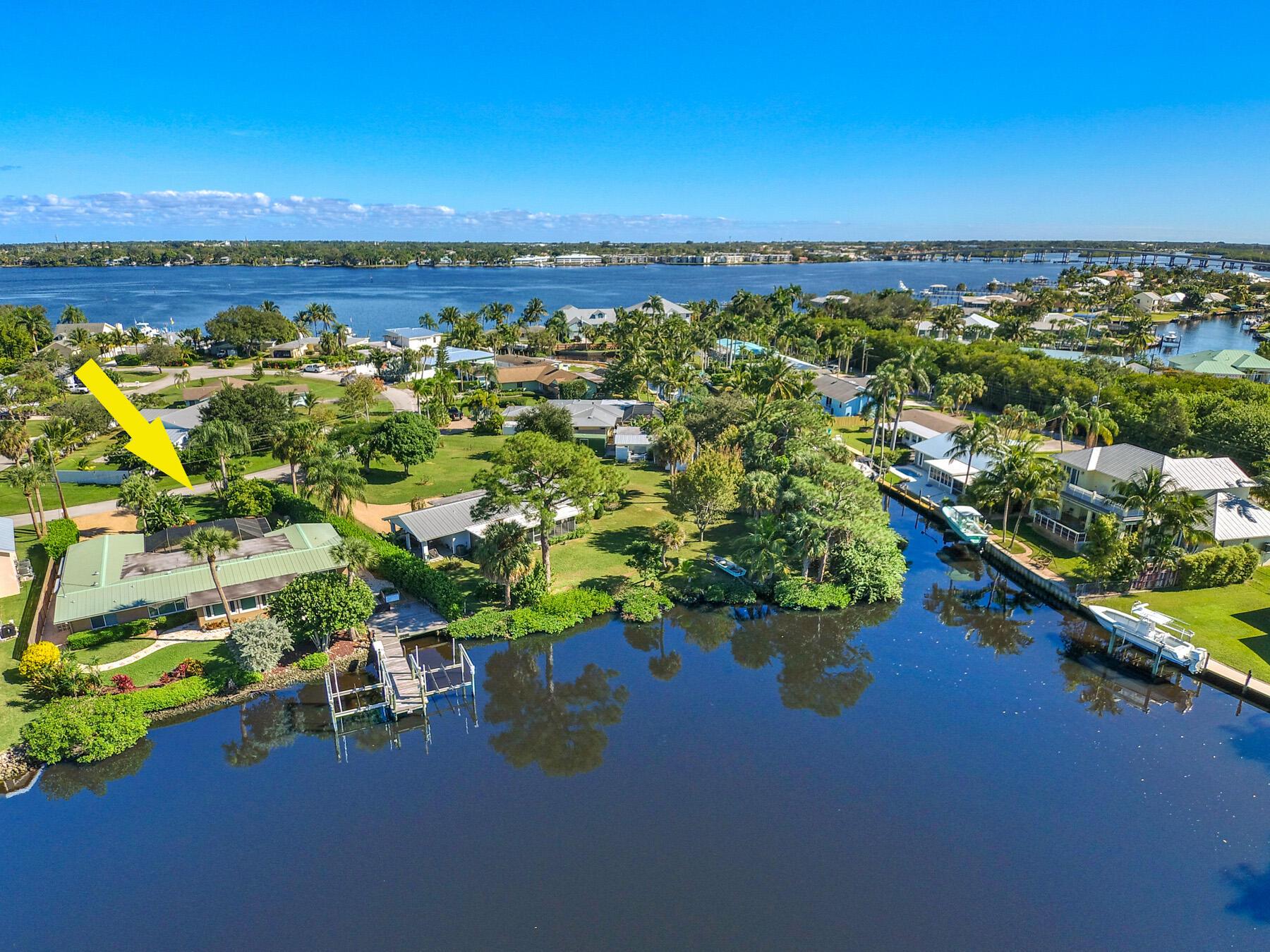 Waterfront Oasis. Located in Pelican Cove, a small cul-de-sac community providing all of the waterfront amenities & privacy. This CBS pool home offers the ideal location nestled in a private deep water lagoon with no fixed bridges to open ocean access! The lush ,tropical landscaping in both the front and back yard is the epitome of the Florida lifestyle. NO HOA. Boat to downtown Stuart waterfront in just a few minutes or enjoy open ocean fishing. Property offers a walk out dock with water & electric as well as 2 boat lifts. Available for summer & upcoming 2025-2026 season