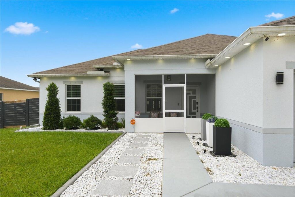Photo of 1118 SW Ingrassina Avenue, Port Saint Lucie, FL 34953 (MLS # R11136502)