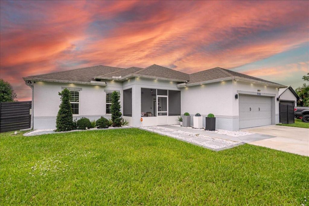 Photo of 1118 SW Ingrassina Avenue, Port Saint Lucie, FL 34953 (MLS # R11136502)