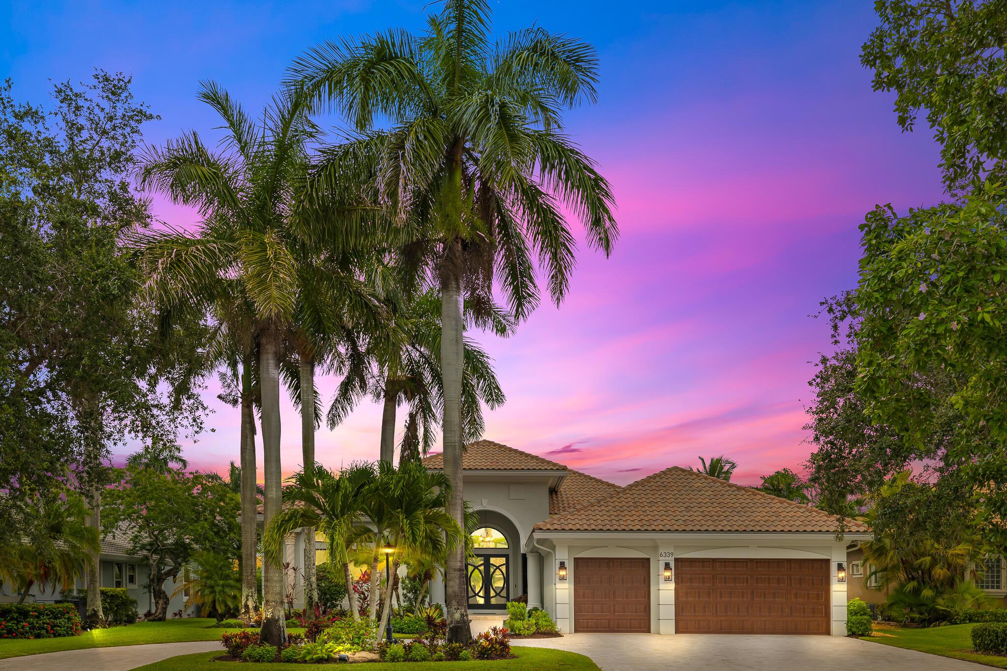 Set on a prime waterfront lot with sweeping lake and preserve views, this fully reimagined Heron Bay estate is the crown jewel of The Falls. Every inch inside and out has been masterfully redesigned with purpose, precision, and quiet luxury. Located in a double-gated community, this one-story home offers nearly 4,000 sq ft of living space with 24x24 porcelain tile, SIW impact glass throughout, and a chef's kitchen featuring a seamless 10x6 quartzite island, custom cabinetry, and commercial-grade ZLine and GE Monogram appliances. Four spa-like bathrooms are finished with Carrara marble, Calacatta quartz, and Moen solid bronze fixtures. Smart features include Lutron programmable lighting, Sonos sound, AvertX 4K security, and smart garage systems.