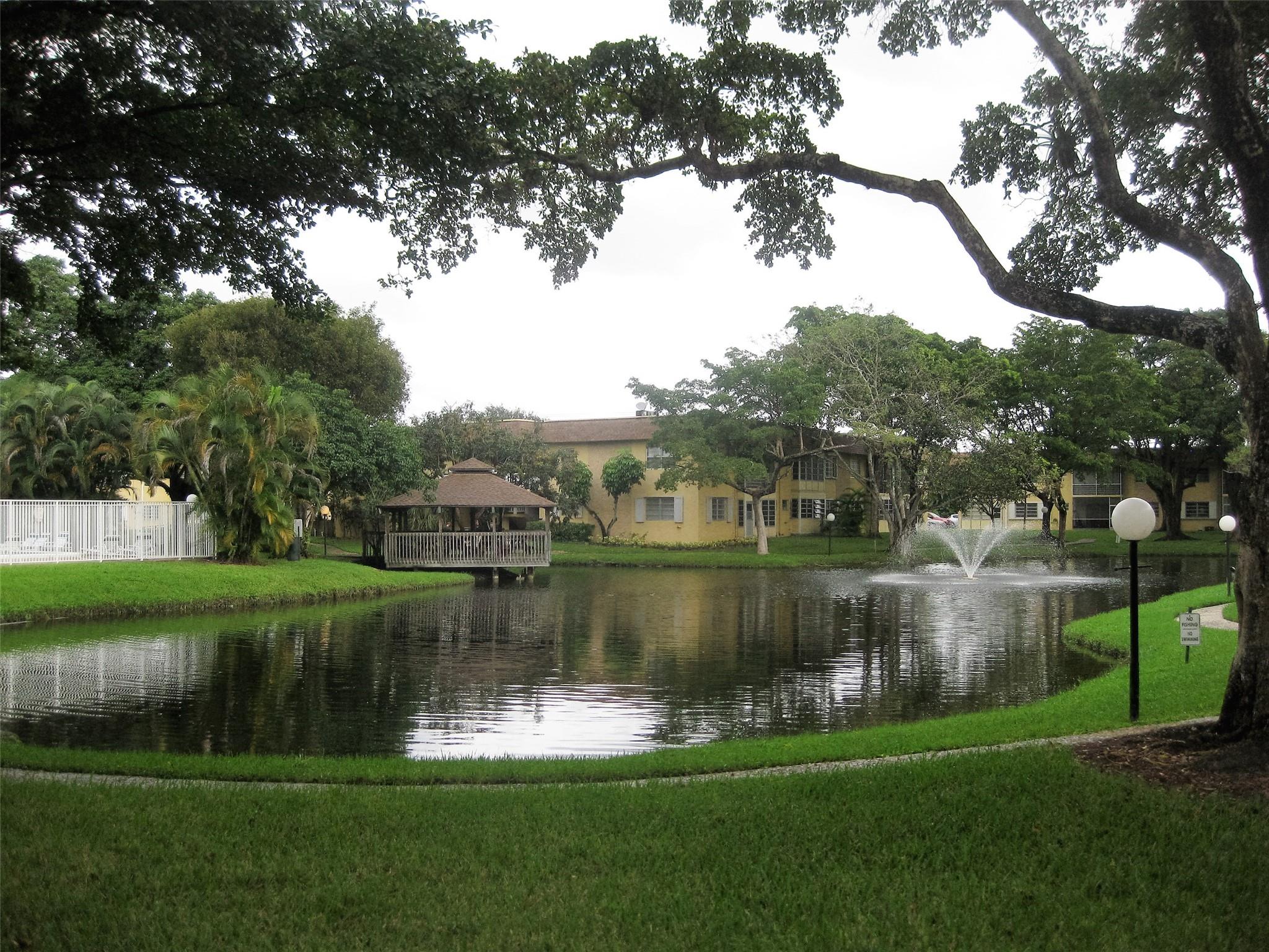 Spacious 1 bedroom 1 1/2 Bath, open floor plan with an artisan flair. Enclosed patio overlooking serene ponds with water fountain. Tile flooring, Stainless-steel appliances, refrigerator, stove, microwave and dishwasher. Full bathroom as a bathtub and powder room area with a large walking closet. Around the scenic ponds is a walkway with several BBQ area, leading to the club house, gazebo and heated pool, quiet community. Application, credit check and screening required. Located close to Hollywood Hard Rock Casino, Turnpike, i-595. One Assign parking and guess parking spaces. Sorry no pet(s)