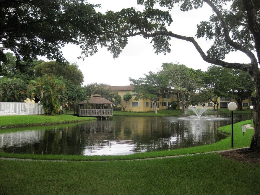Spacious 1 bedroom 1 1/2 Bath, open floor plan with an artisan flair. Enclosed patio overlooking serene ponds with water fountain. Tile flooring, Stainless-steel appliances, refrigerator, stove, microwave and dishwasher. Full bathroom as a bathtub and powder room area with a large walking closet. Around the scenic ponds is a walkway with several BBQ area, leading to the club house, gazebo and heated pool, quiet community. Application, credit check and screening required. Located close to Hollywood Hard Rock Casino, Turnpike, i-595. One Assign parking and guess parking spaces. Sorry no pet(s)
