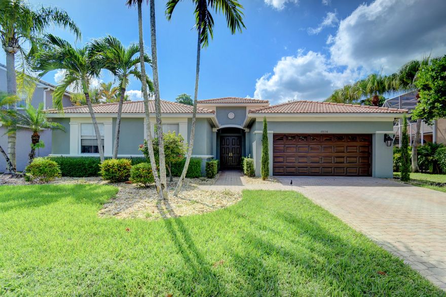Beautifully maintained 4 bedroom, 2.5 pool home in the  Shores at Boca Raton.  This home is complete with high ceilings, open floor plan, updated bathrooms, brand new carpevting in the bedrooms and tile floors everywhere else, newer appliances and newer AC's. Extremely private lot backing up to a canal and the preserve. A-rated schools, and close to shopping, restaurants and South County Park. Don't miss out on the opportunity to make this house your home!