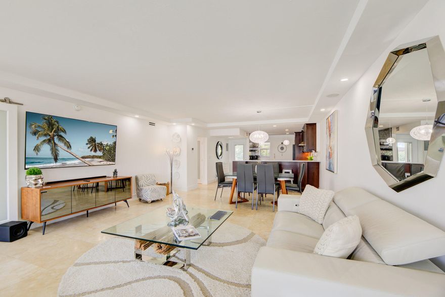 Dock your 50' yacht with direct ocean access and NO fixed bridges — a rare Fort Lauderdale waterfront opportunity offering true deep water living. This fully renovated, turnkey coastal 2BR/2BA features travertine flooring, custom tray ceilings with LED lighting, and a modern kitchen with Samsung ChefEdition appliances and a new refrigerator. The expanded primary suite includes an upgraded bath and a ventless washer/dryer in the walkin closet. Hurricane impact windows and doors throughout.  Major upgrades include updated electrical, new panel, new water lines, and a tankless water heater, delivering true moveinready confidence. Dockage available up to 50 ft at just $10/ft, ideal for serious boaters seeking fast access to the Intracoastal and ocean. This pet friendly community offers 3 pools (1 heated), BBQ areas, a dog park, and beautifully maintained grounds. Perfectly located within walking distance to the beach, Kaluz, Blue Moon and several other fine restaurants, cafés, and vibrant Lauderdale by the Sea nightlife, this property appeals to full time residents, seasonal owners, and investors seeking strong rental potential in a high demand coastal market. Whether you're looking for a boater's paradise, a winter escape, a second home, or a turn key investment, this residence delivers the South Florida lifestyle at its best!!  Reserves have been paid current building reserve is funded. All Certification and SIRS have been completed, with recent community upgrades: New Elevators, Dock, Pool and AC water towers, new roof 2025.
