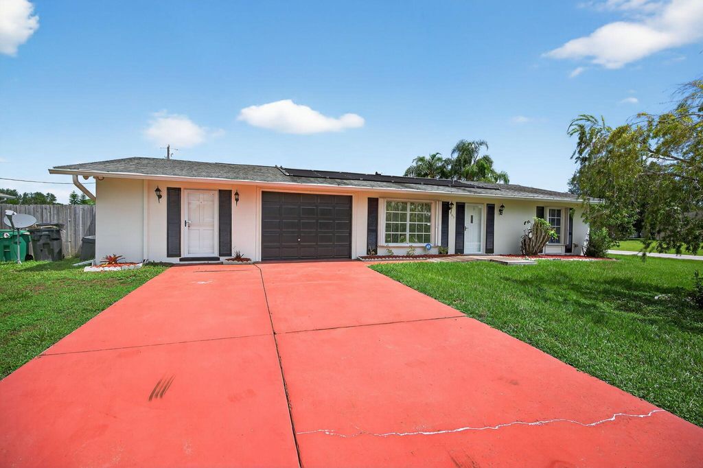 Photo of 505 SW Lakehurst Drive, Port Saint Lucie, FL 34983 (MLS # R11115951)