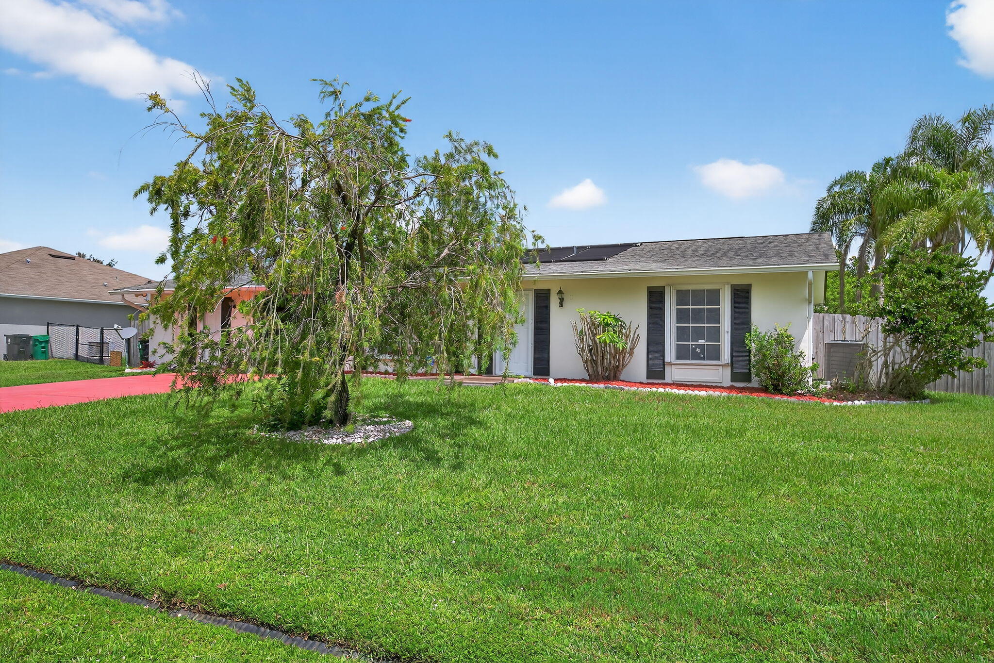 Welcome to your dream setup in Port St. Lucie! This beautifully updated home features a stylish main residence with a renovated kitchen and bathrooms, gold finishes, and recessed lighting throughout. Step outside to enjoy a sparkling pool--perfect for relaxing weekends or unforgettable family gatherings. What truly sets this property apart is the fully equipped in-law suite with its own kitchen--ideal for extended family, guests, or even as a rental to cover part of your mortgage. Located just minutes from I-95 and all your favorite shopping spots, this is the flexible Florida lifestyle you've been looking for!