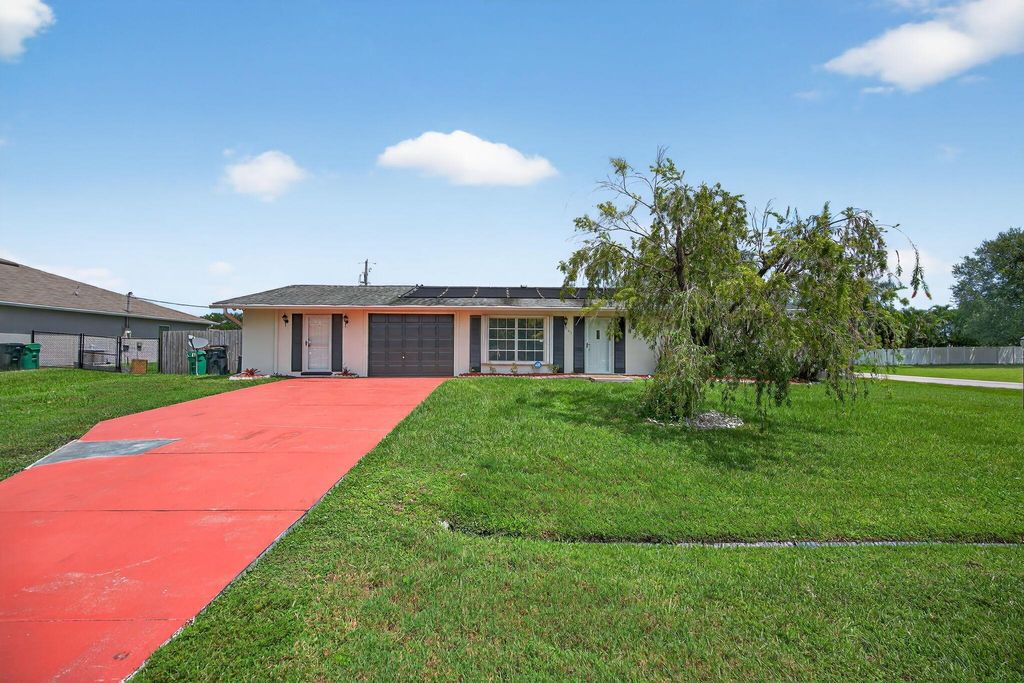 Photo of 505 SW Lakehurst Drive, Port Saint Lucie, FL 34983 (MLS # R11115951)